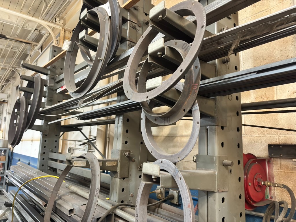 Structural tube, flat bar, and duct flange rings on cantilever rack